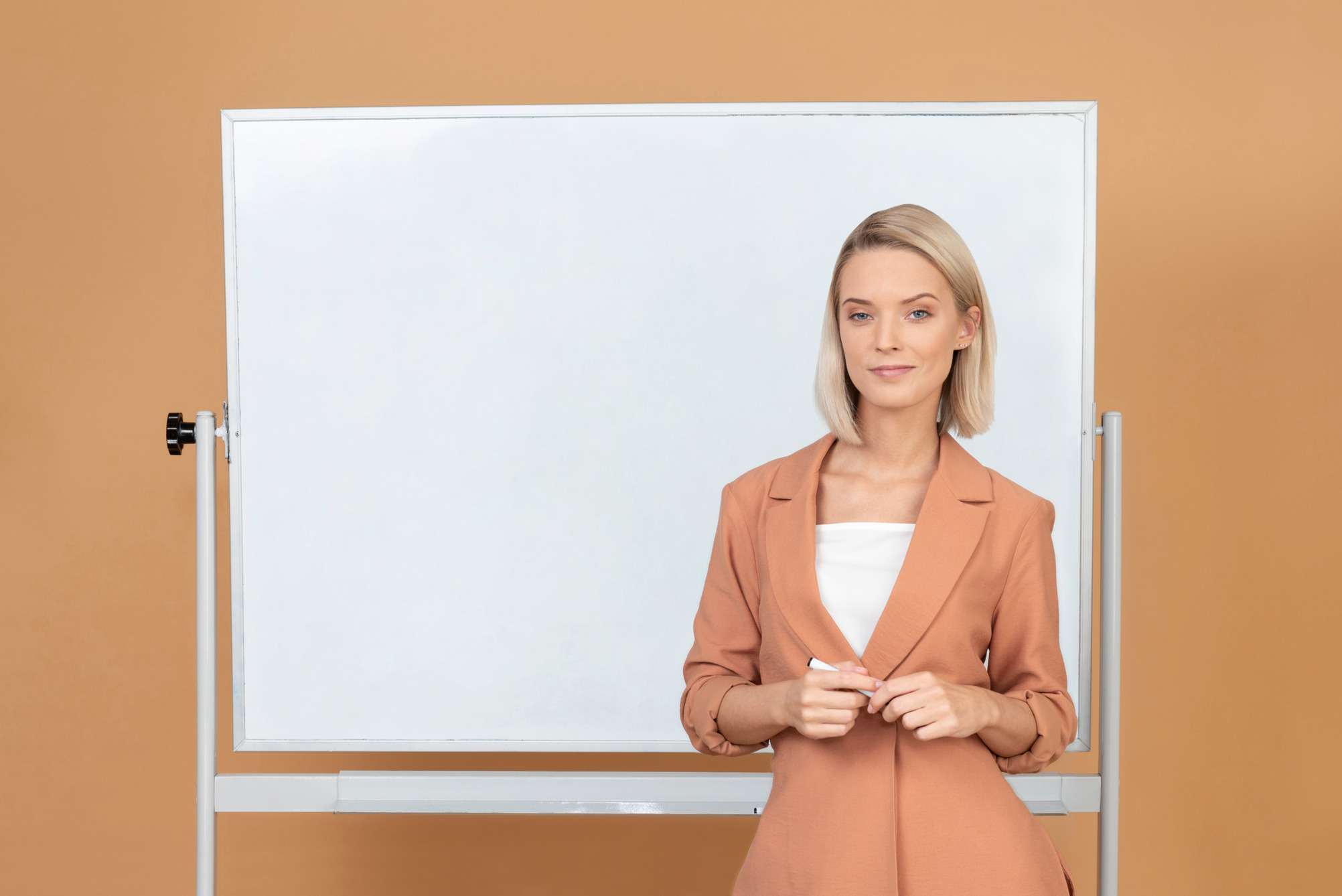 attractive-young-woman-explaining-something-near-the-whiteboard